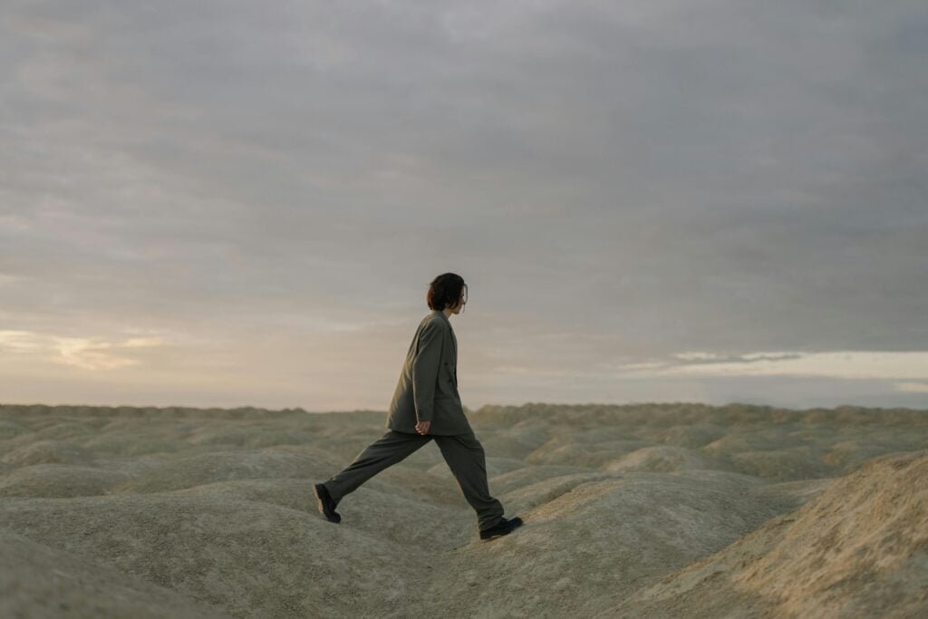 Image of a person walking outdoors: