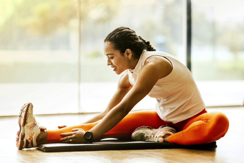 Woman stretching before a workout to improve flexibilit