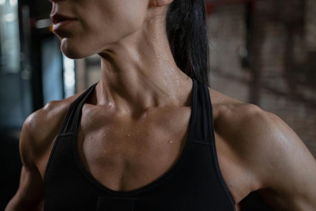 Individual demonstrating chin tucks exercise for improving neck posture